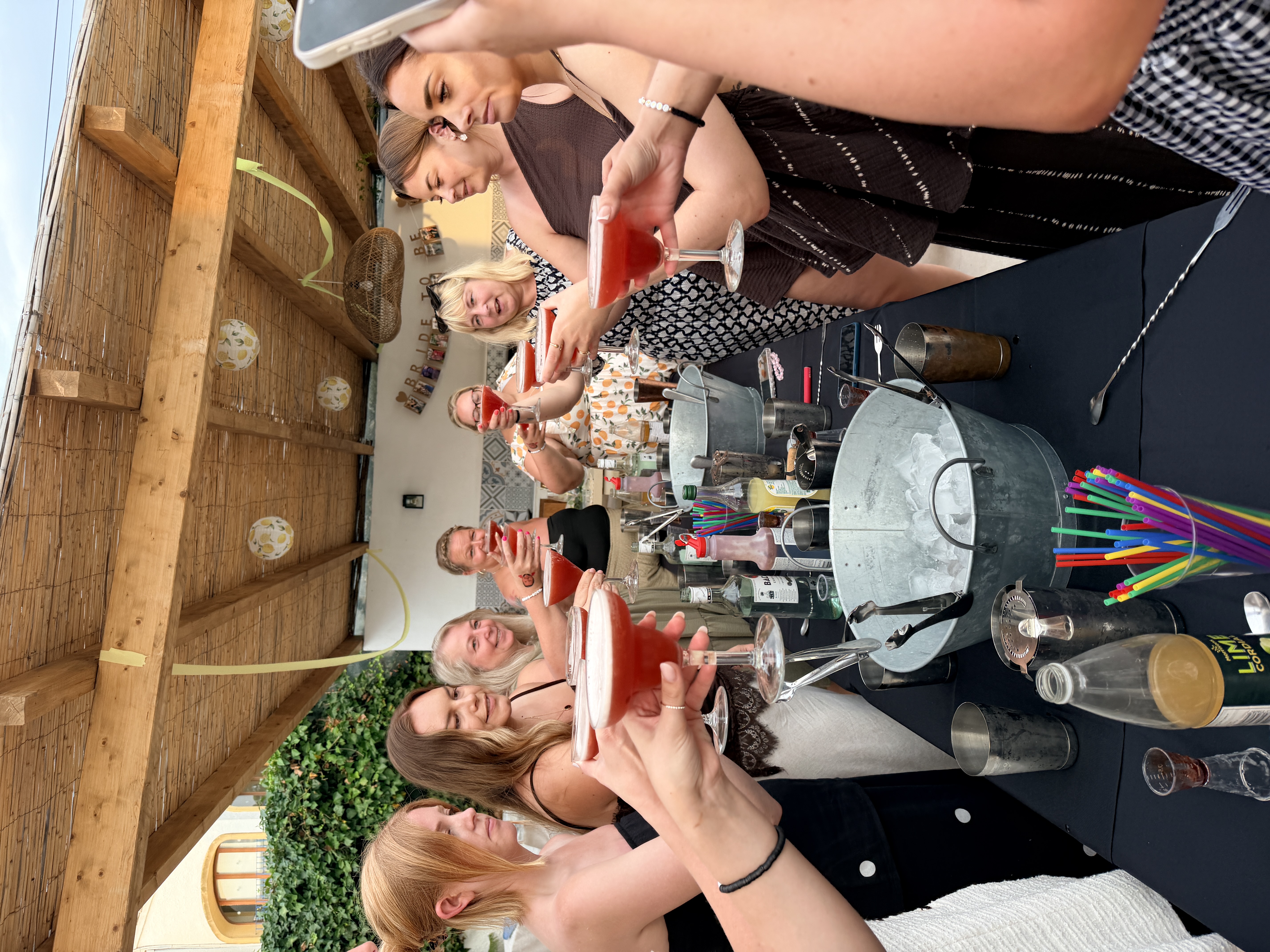 British hen group toasting with cocktails during a villa workshop