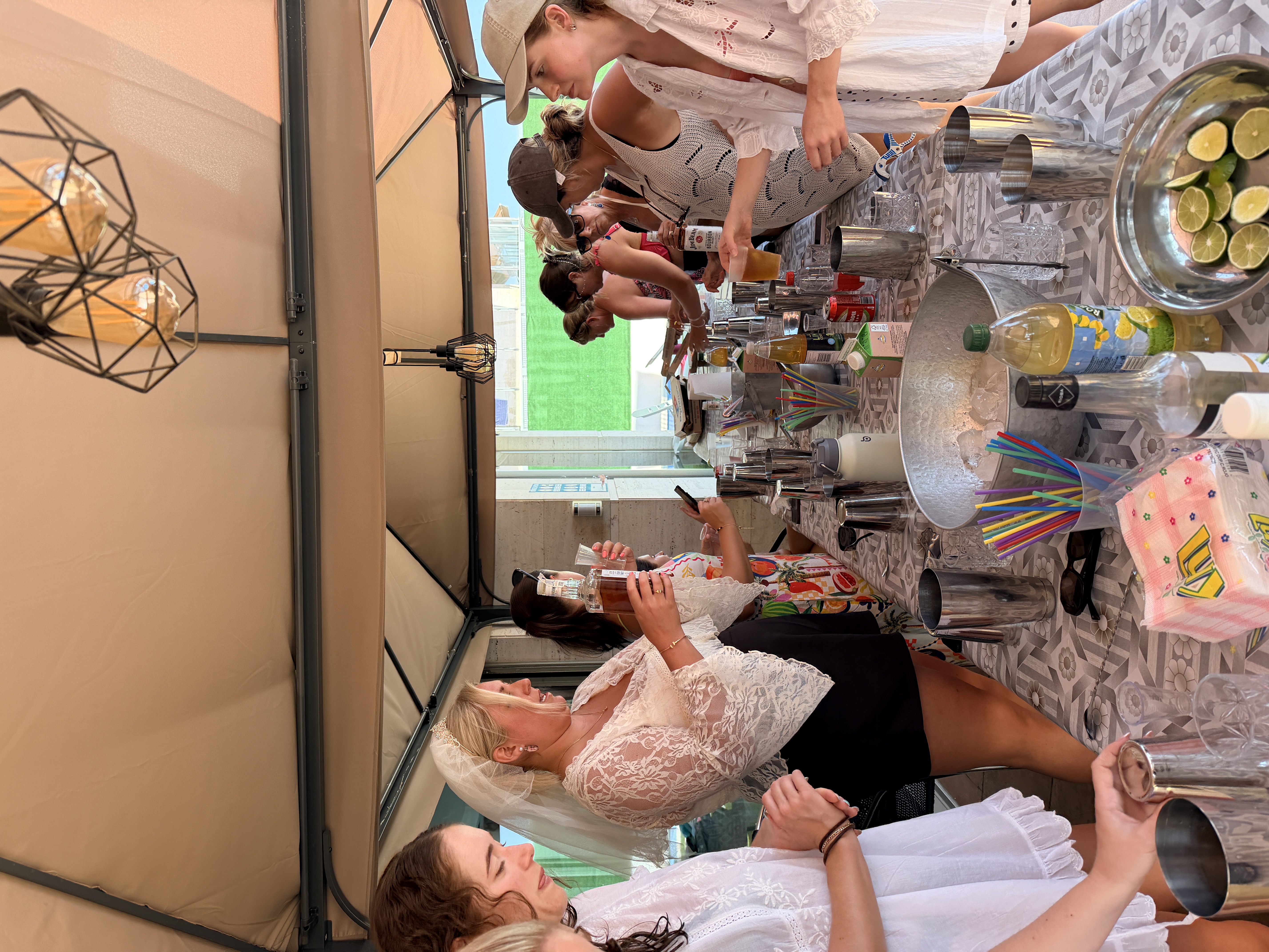 Bride-to-be and friends taking part in a cocktail workshop at their villa